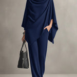 Two-piece set featuring a high-neck cape-style top and wide-leg trousers.