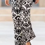 Black top and printed trousers set (accessories not included)