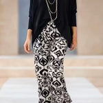 Black top and printed trousers set (accessories not included)