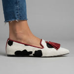 Ginevra Moccasin™ | Black and White Cow Print, Red Tassels