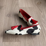 Ginevra Moccasin™ | Black and White Cow Print, Red Tassels